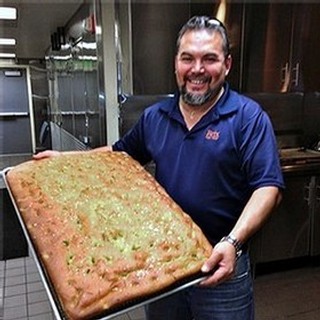 Memo's in the kitchen making fresh Focaccia